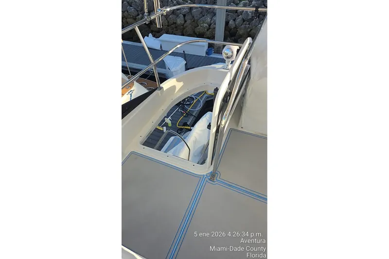 Slide: The Image of 2023 Regal 38 FXO boat interior with wooden table and speaker, Miami-Dade County. - 21
