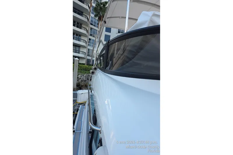 Slide: The Image of 2023 Regal 38 FXO boat deck with engines, located in Aventura, Florida. - 22