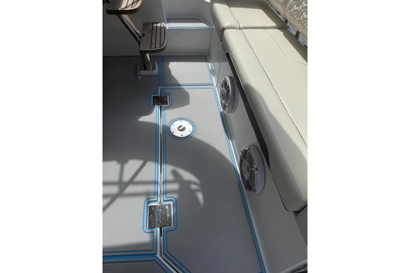 Slide: The Image of 2023 Regal 38 FXO boat stern with Yamaha outboard engine, docked on calm water. - 34