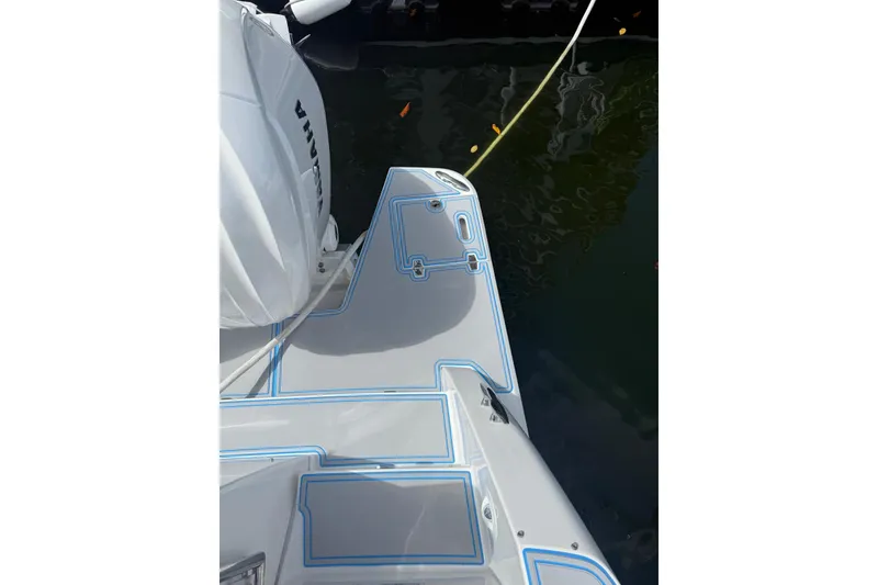 Slide: The Image of 2023 Regal 38 FXO boat deck with logo and sleek design. - 36
