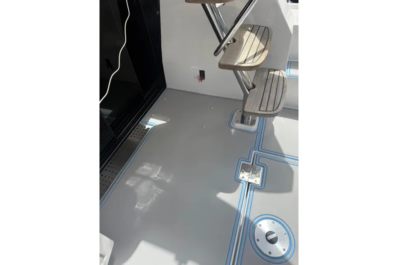 Slide: The Image of 2023 Regal 38 FXO yacht docked beside a wooden pier. - 40