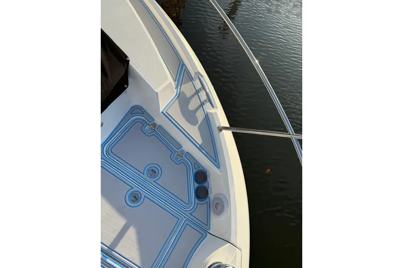 Slide: The Image of 2023 Regal 38 FXO boat deck with sleek design and stainless steel railings. - 44