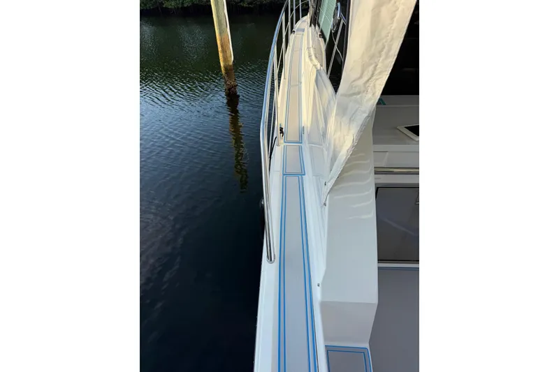 Slide: The Image of 2023 Regal 38 FXO boat interior with cushioned seating and modern design. - 53