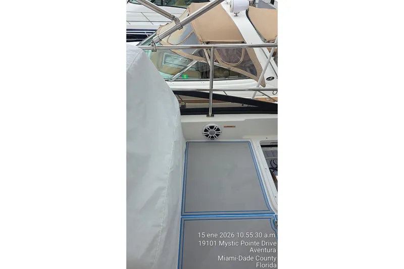 Slide: The Image of 2023 Regal 38 FXO boat deck with seating and speaker, docked in Aventura, Florida. - 65