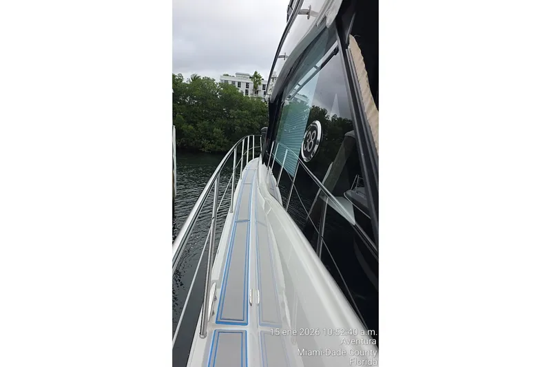 Slide: The Image of 2023 Regal 38 FXO yacht side view, docked in Miami-Dade County, Florida. - 75