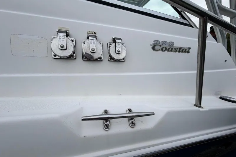 Slide: The Image of 2001 Wellcraft 290 Coastal boat with power outlets and railing detail. - 22