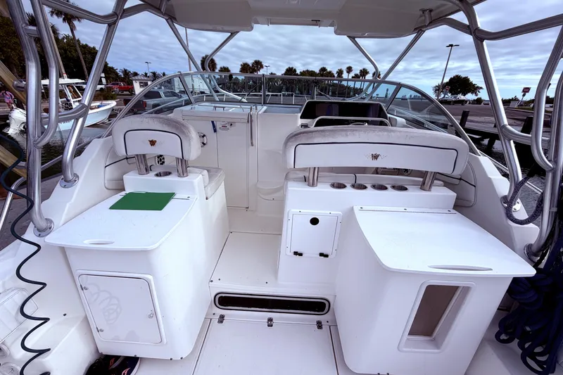 Slide: The Image of 2001 Wellcraft 290 Coastal boat interior with seating and storage compartments. - 32
