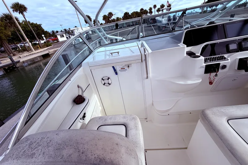 Slide: The Image of 2001 Wellcraft 290 Coastal boat interior with helm, seating, and control panel. - 39