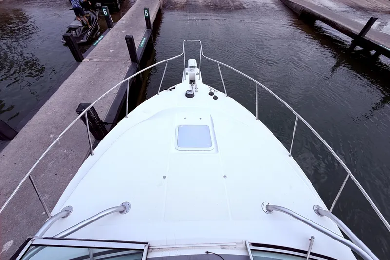 Slide: The Image of Bow view of 2001 Wellcraft 290 Coastal boat docked at marina. - 45