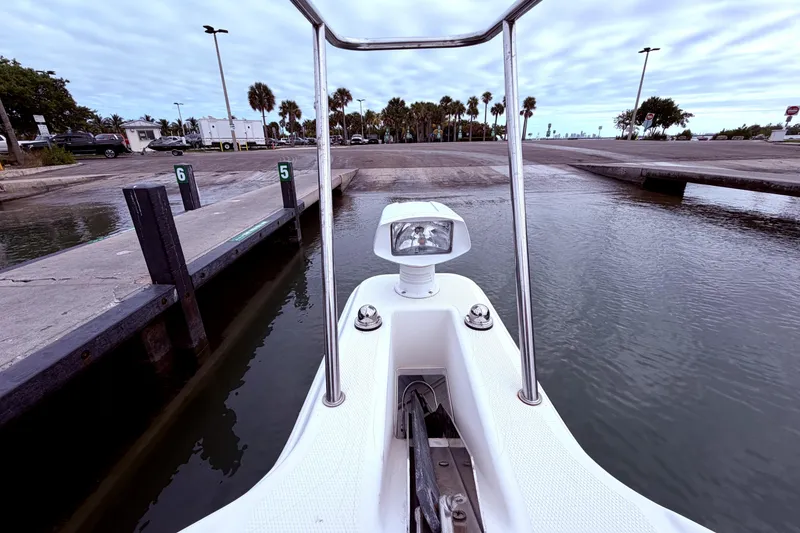 Slide: The Image of Bow view of 2001 Wellcraft 290 Coastal at a boat ramp, ready for launch. - 49