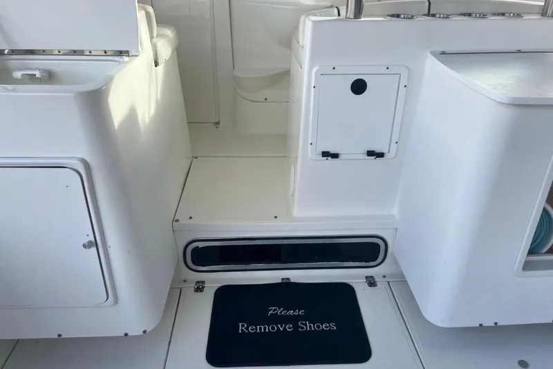 Slide: The Image of Close-up of a Wellcraft 290 Coastal 2001 boat propeller on wet pavement. - 5