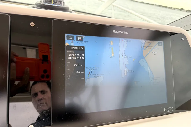 Slide: The Image of Raymarine navigation display on 2001 Wellcraft 290 Coastal boat, showing map and coordinates. - 60