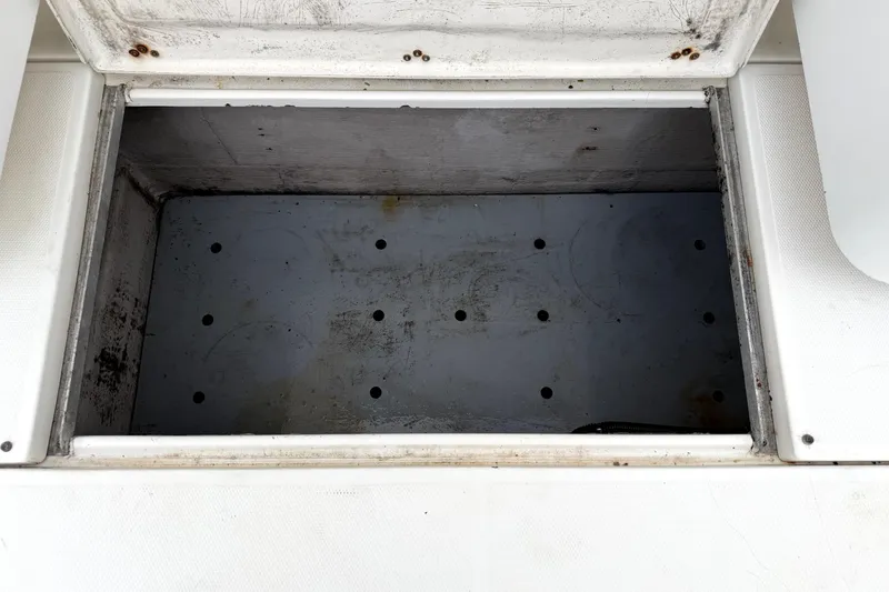 Slide: The Image of Open storage compartment on 2001 Wellcraft 290 Coastal boat, showing interior details. - 66