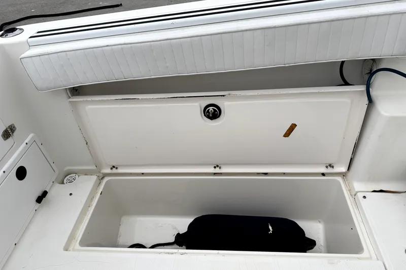 Slide: The Image of Open storage compartment on a 2001 Wellcraft 290 Coastal boat. - 67