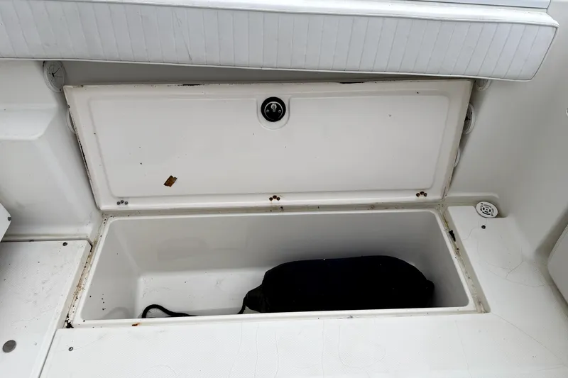 Slide: The Image of Open storage compartment on a 2001 Wellcraft 290 Coastal boat. - 68
