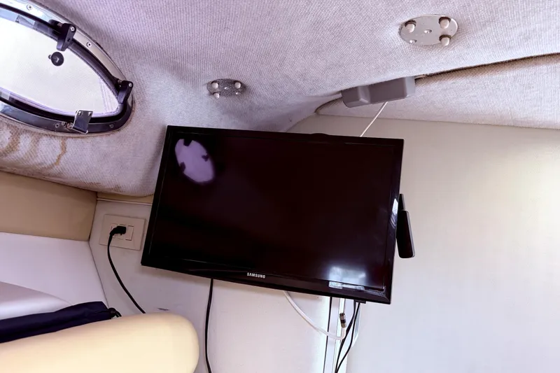 Slide: The Image of Interior of 2001 Wellcraft 290 Coastal boat with mounted Samsung TV and porthole. - 72