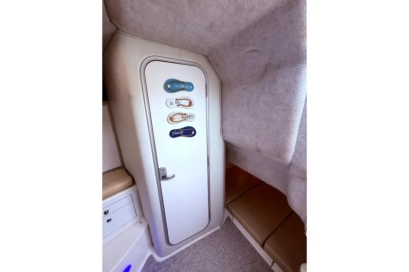 Slide: The Image of Interior cabin of 2001 Wellcraft 290 Coastal boat with decorative door signs. - 77