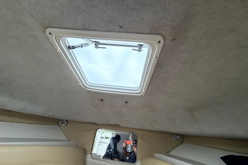 Slide: The Image of Interior view of 2001 Wellcraft 290 Coastal boat cabin with ceiling hatch. - 81