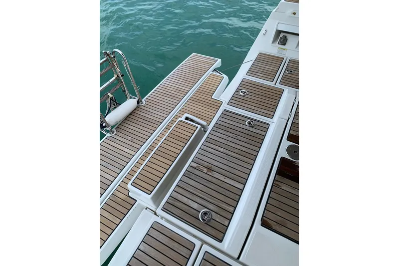 Slide: The Image of Teak deck of 2013 Beneteau Oceanis 45 yacht with swim platform. - 10