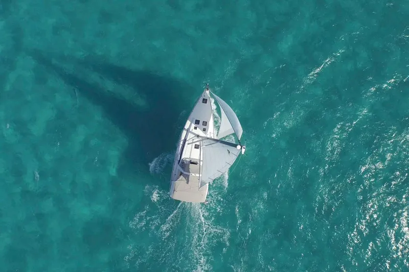 Slide: The Image of Aerial view of 2013 Beneteau Oceanis 45 sailing on turquoise waters. - 3