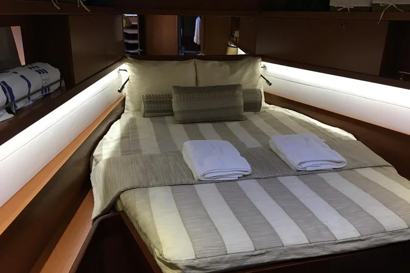 Slide: The Image of Luxurious cabin interior of 2013 Beneteau Oceanis 45 yacht with cozy bedding. - 8