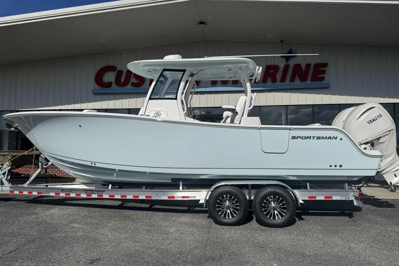The Image of 2026 Sportsman Open 282 Center Console boat on trailer outside Custom Marine. - 0