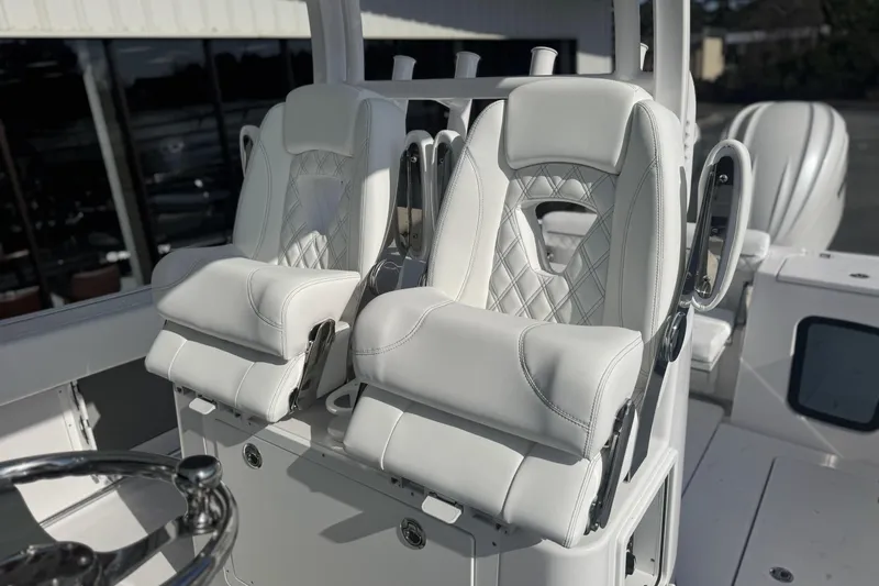 Slide: The Image of 2026 Sportsman Open 282 Center Console with luxurious white seating. - 11