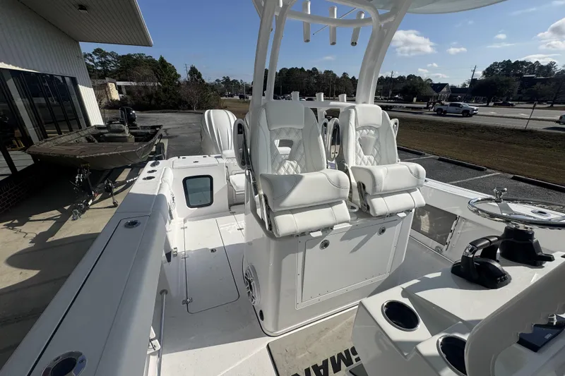 Slide: The Image of 2026 Sportsman Open 282 Center Console boat with luxurious seating and modern design. - 12