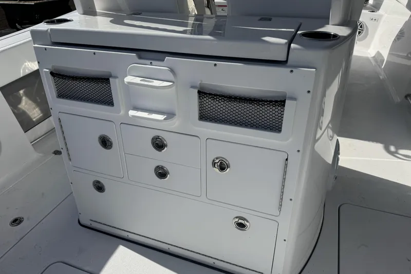 Slide: The Image of 2026 Sportsman Open 282 Center Console boat interior with storage compartments. - 20