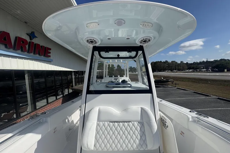 Slide: The Image of 2026 Sportsman Open 282 Center Console boat at a marine dealership. - 24