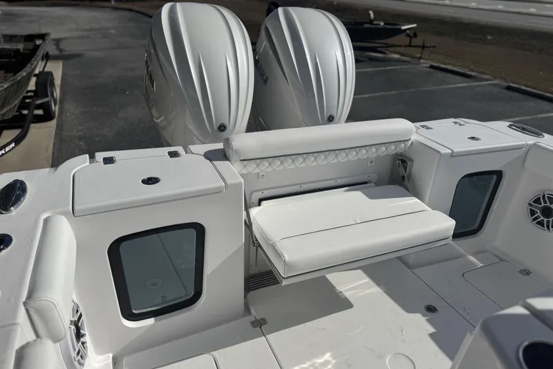 Slide: The Image of 2026 Sportsman Open 282 Center Console boat with dual engines and seating area. - 7