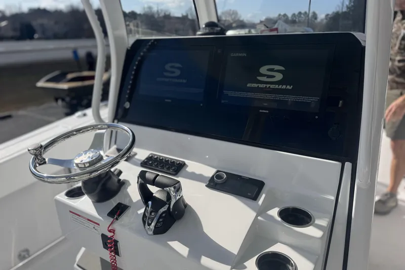 Slide: The Image of 2026 Sportsman Open 282 Center Console dashboard with steering wheel and digital displays. - 8