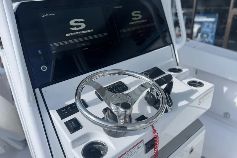 Slide: The Image of 2026 Sportsman Open 282 Center Console helm with Garmin displays and steering wheel. - 9