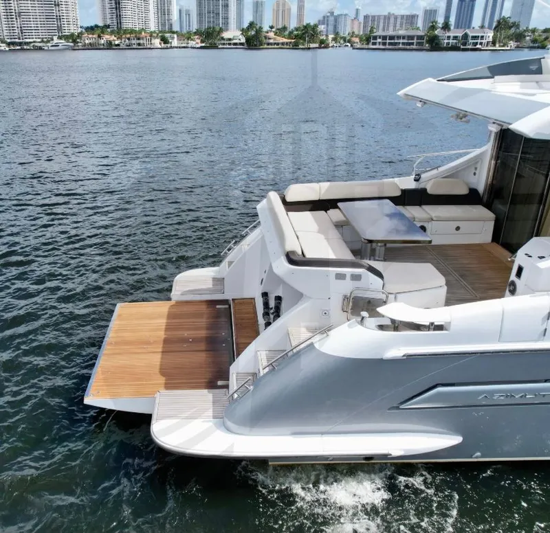 Slide: The Image of 2015 Azimut 55S yacht with spacious deck on calm water. - 11