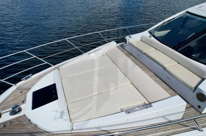 Slide: The Image of 2015 Azimut 55S yacht with spacious sunbathing deck on calm water. - 21