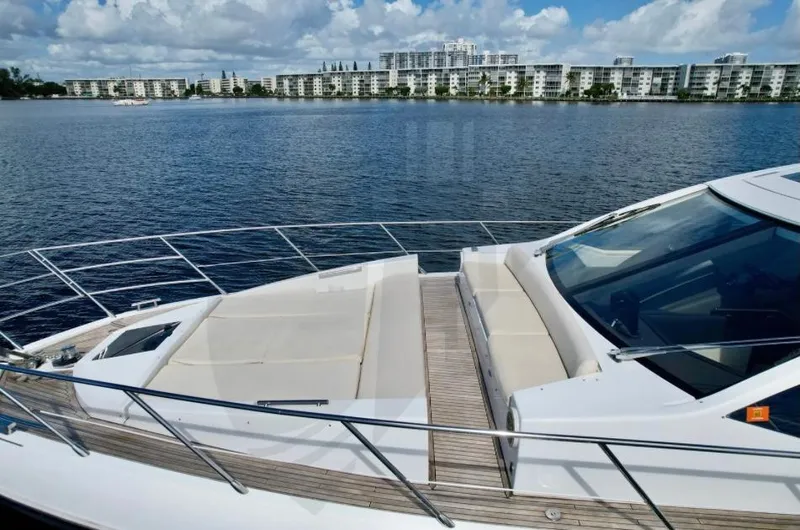 Slide: The Image of Azimut 55S 2015 yacht on calm water with cityscape background. - 23