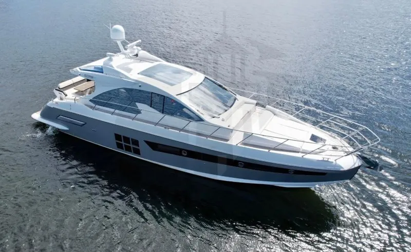 Slide: The Image of 2015 Azimut 55S luxury yacht cruising on open water. - 26