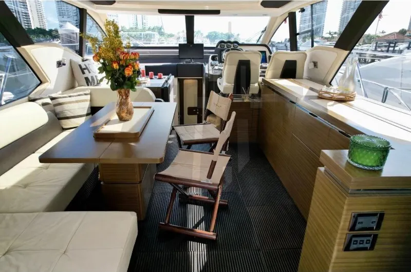 Slide: The Image of Luxurious interior of a 2015 Azimut 55S yacht with elegant seating and decor. - 29