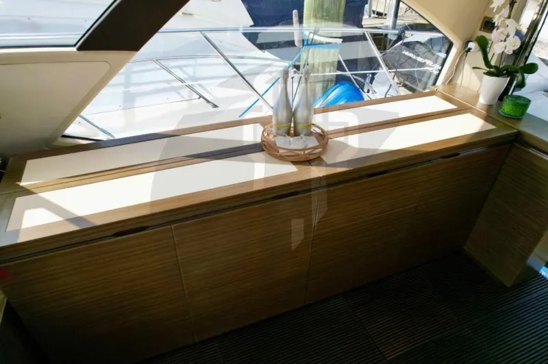 Slide: The Image of Interior of 2015 Azimut 55S yacht with elegant wooden cabinetry and decor. - 30