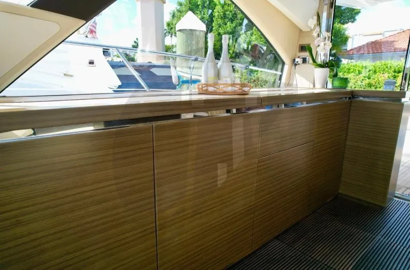 Slide: The Image of Luxurious interior of 2015 Azimut 55S yacht with sleek wooden cabinetry. - 31