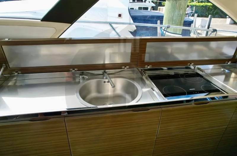 Slide: The Image of Modern kitchen on 2015 Azimut 55S yacht with sink and stove. - 32