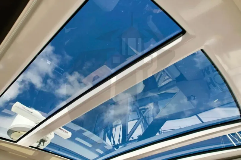 Slide: The Image of Azimut 55S 2015 yacht sunroof with blue sky reflection. - 35