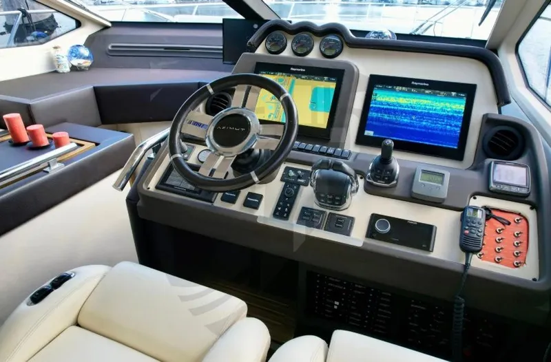 Slide: The Image of Cockpit of 2015 Azimut 55S yacht with advanced navigation controls and displays. - 38