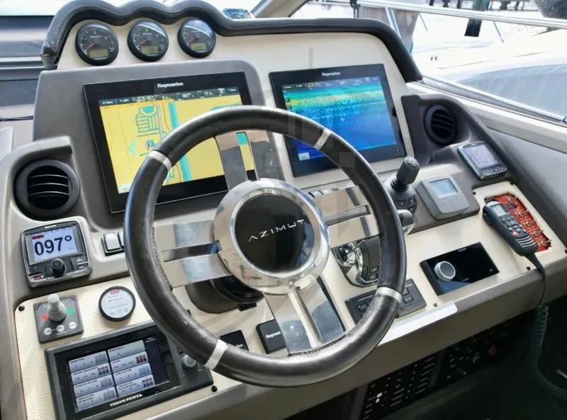 Slide: The Image of Azimut 55S 2015 yacht dashboard with navigation screens and controls. - 44