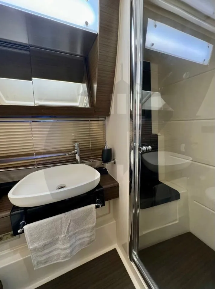 Slide: The Image of Luxurious bathroom in 2015 Azimut 55S yacht with modern sink and mirror. - 46