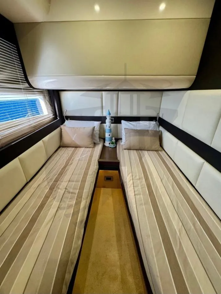 Slide: The Image of Luxurious 2015 Azimut 55S yacht cabin with twin beds and modern decor. - 47