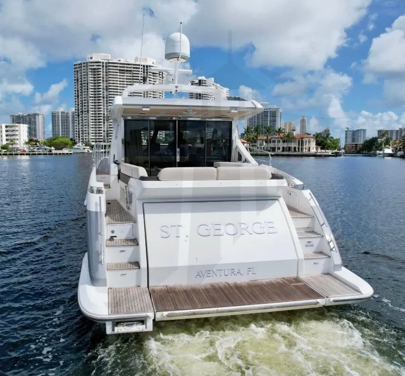 Slide: The Image of Azimut 55S 2015 yacht cruising in Aventura, Florida, with city skyline backdrop. - 6