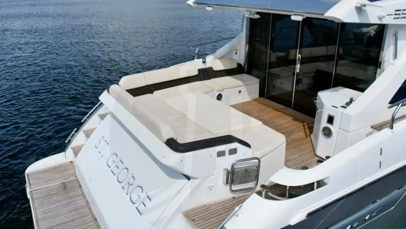 Slide: The Image of Azimut 55S 2015 yacht with spacious deck and seating area on the water. - 9
