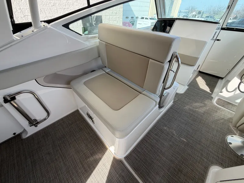 Slide: The Image of Interior of 2025 Boston Whaler 28 Vantage with beige seating. - 10