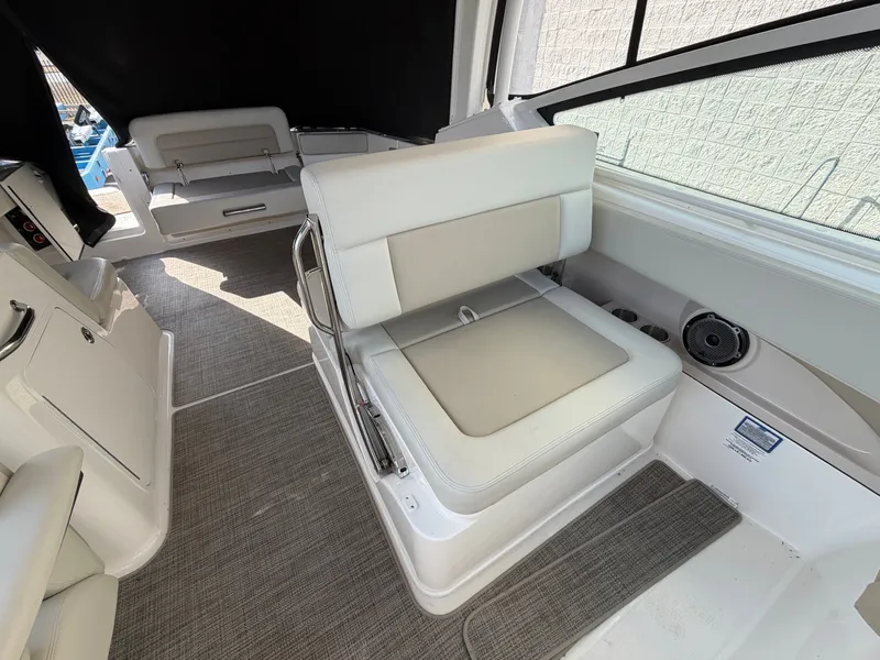 Slide: The Image of Interior of 2025 Boston Whaler 28 Vantage with beige seating. - 12